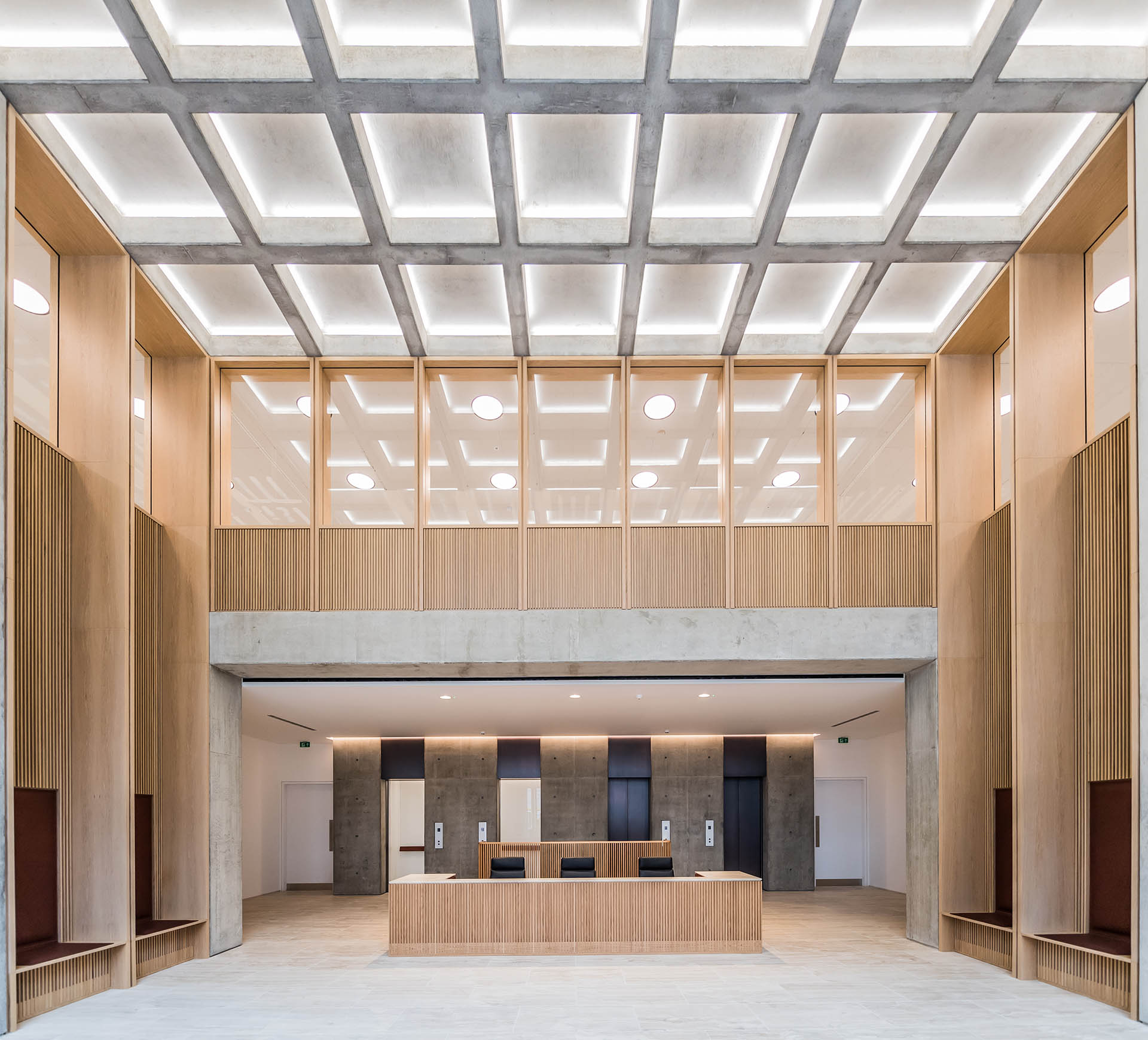 The reception area used visual concrete to construct the waffle slabs, double height columns and the lift entrance and shaft.