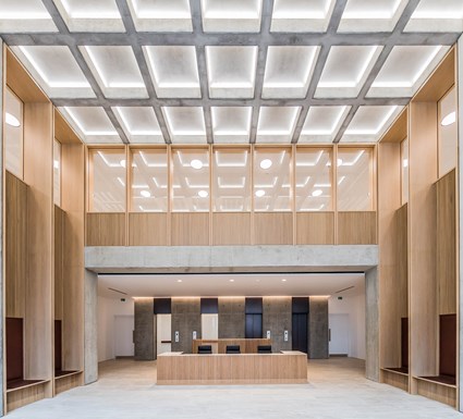 The reception area used visual concrete to construct the waffle slabs, double height columns and the lift entrance and shaft.