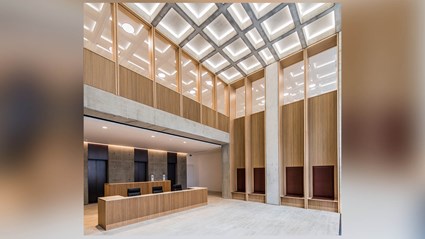 The reception area has Travertine Stone flooring and oak cladding.