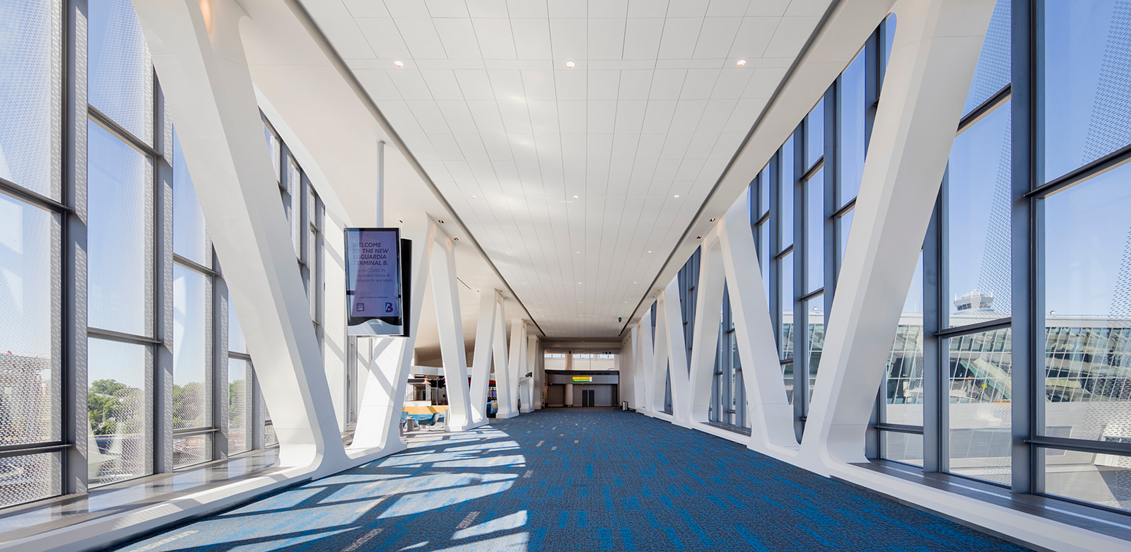 Pedestrian bridges connect the Central Terminal with Concourses A and B, providing travelers a unique view of taxiing aircraft.